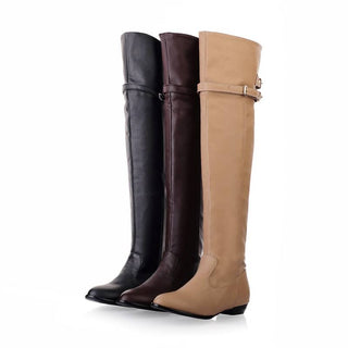 Photo de trois bottes cavalière montantes, une beige, une marron et une noire
