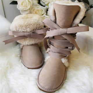 High snow boots made of genuine sheepskin