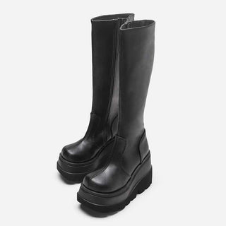 Black leather platform boots with zipper closure