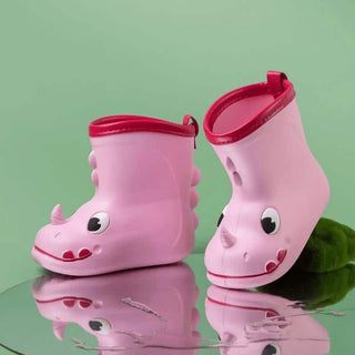 Bottes de pluie roses motif rhinocéros, sur fond vert